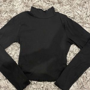 Black turtle neck with ruffled/lettuce edges